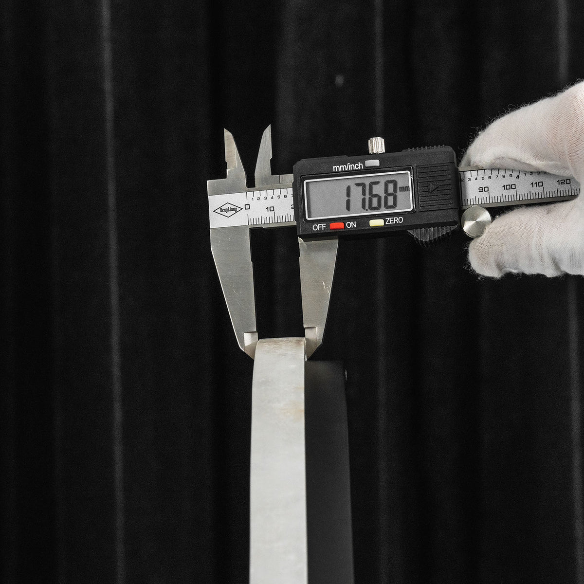 Elvire Alabaster Disc Table Lamp | Natural Alabaster | Digital caliper measuring the thickness of the natural alabaster stem | Severn Lighting