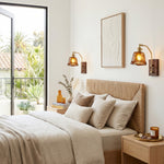 Everett Amber Ripple Wall Sconce | Amber Rippled Glass and Walnut Wood | Two sconces mounted above the bed in a bright modern bedroom filled with sunlight | Severn Lighting