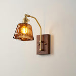 Everett Amber Ripple Wall Sconce | Amber Rippled Glass and Walnut Wood | Symmetrical view of the illuminated wall sconce casting a warm ambient glow | Severn Lighting