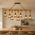 Fermaine Cage Chandelier | Wood, Rope, and Iron | Multi-light long beam model lit above wood dining table | Severn Lighting