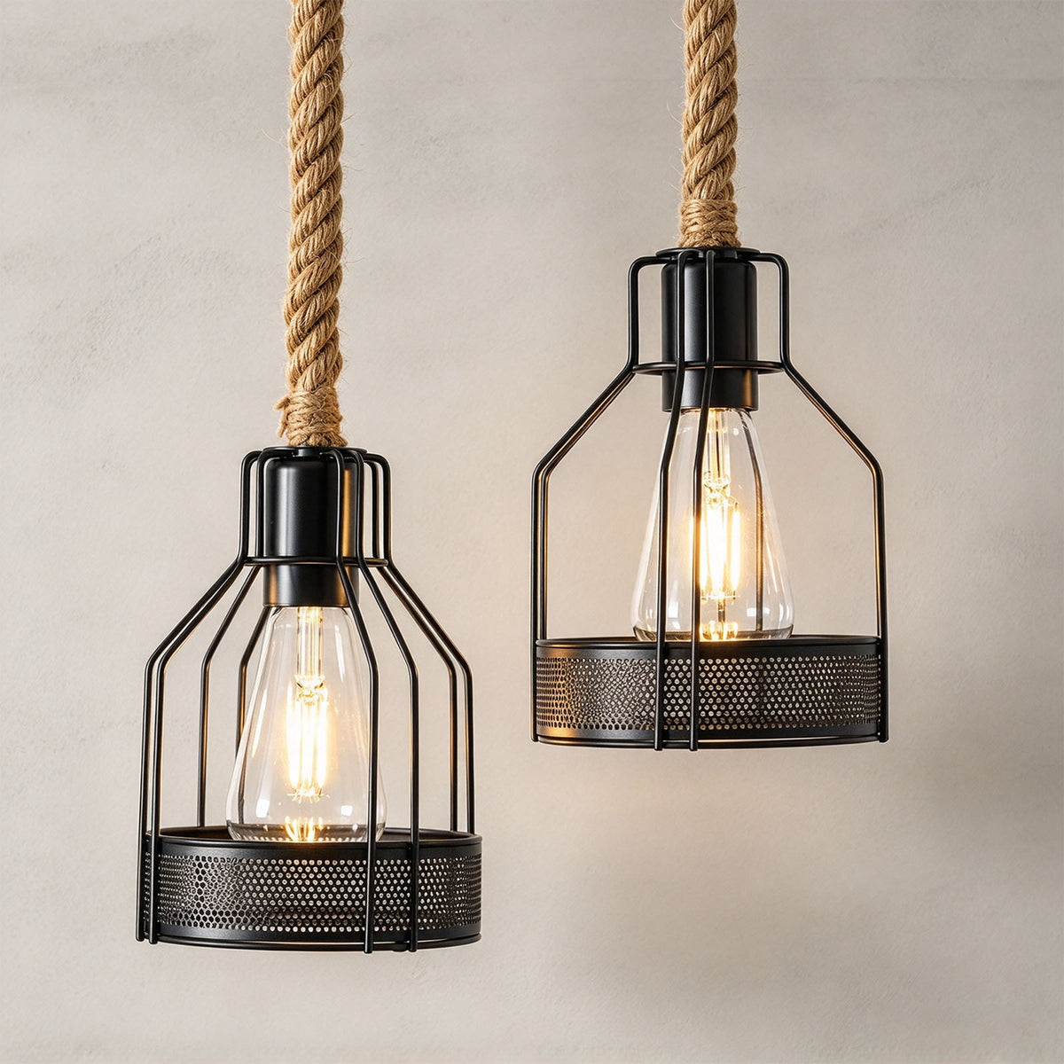 Fermaine Cage Chandelier | Iron Wire and Rope | Close-up of two illuminated cage pendants on rope cords | Severn Lighting