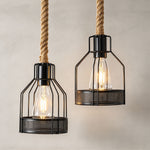 Fermaine Cage Chandelier | Iron Wire and Rope | Close-up of two illuminated cage pendants on rope cords | Severn Lighting