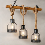 Fermaine Cage Chandelier | Wood, Rope, and Iron | 3-light compact model hanging against neutral wall | Severn Lighting