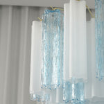 Givrane Two-Tone Glass Tube Tiered Chandelier | Two-Tone Glass and Brass | Close-up detail of alternating textured blue and frosted white glass tubes | Severn Lighting