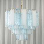 Givrane Two-Tone Glass Tube Tiered Chandelier | Two-Tone Glass and Brass | Studio product view hanging gracefully against a striped white backdrop | Severn Lighting