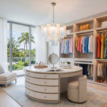 Givrane Two-Tone Glass Tube Tiered Chandelier | Two-Tone Glass and Brass | Styled in a bright luxury dressing room with curved vanity and wardrobe | Severn Lighting