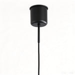 Holmvik Walnut Ring Tiered Metal Pendant Light | Walnut Wood and Metal | Close-up detail shot of the minimalist black metal ceiling canopy and cord | Severn Lighting