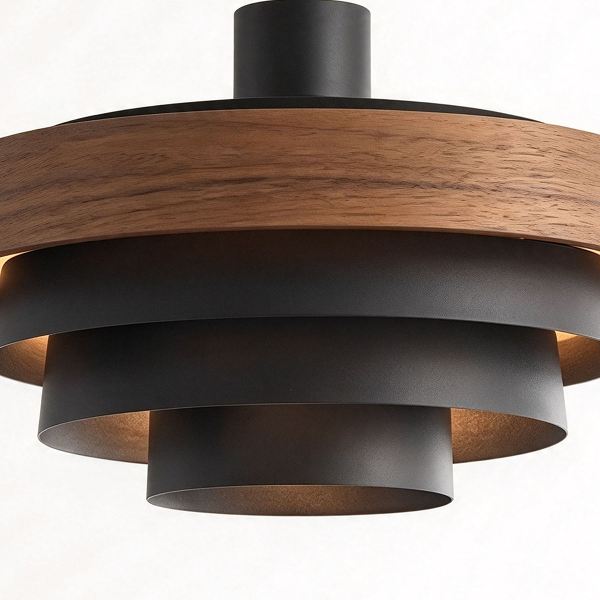 Holmvik Walnut Ring Tiered Metal Pendant Light | Walnut Wood and Metal | Side close-up view highlighting concentric black metal shades beneath wood ring | Severn Lighting