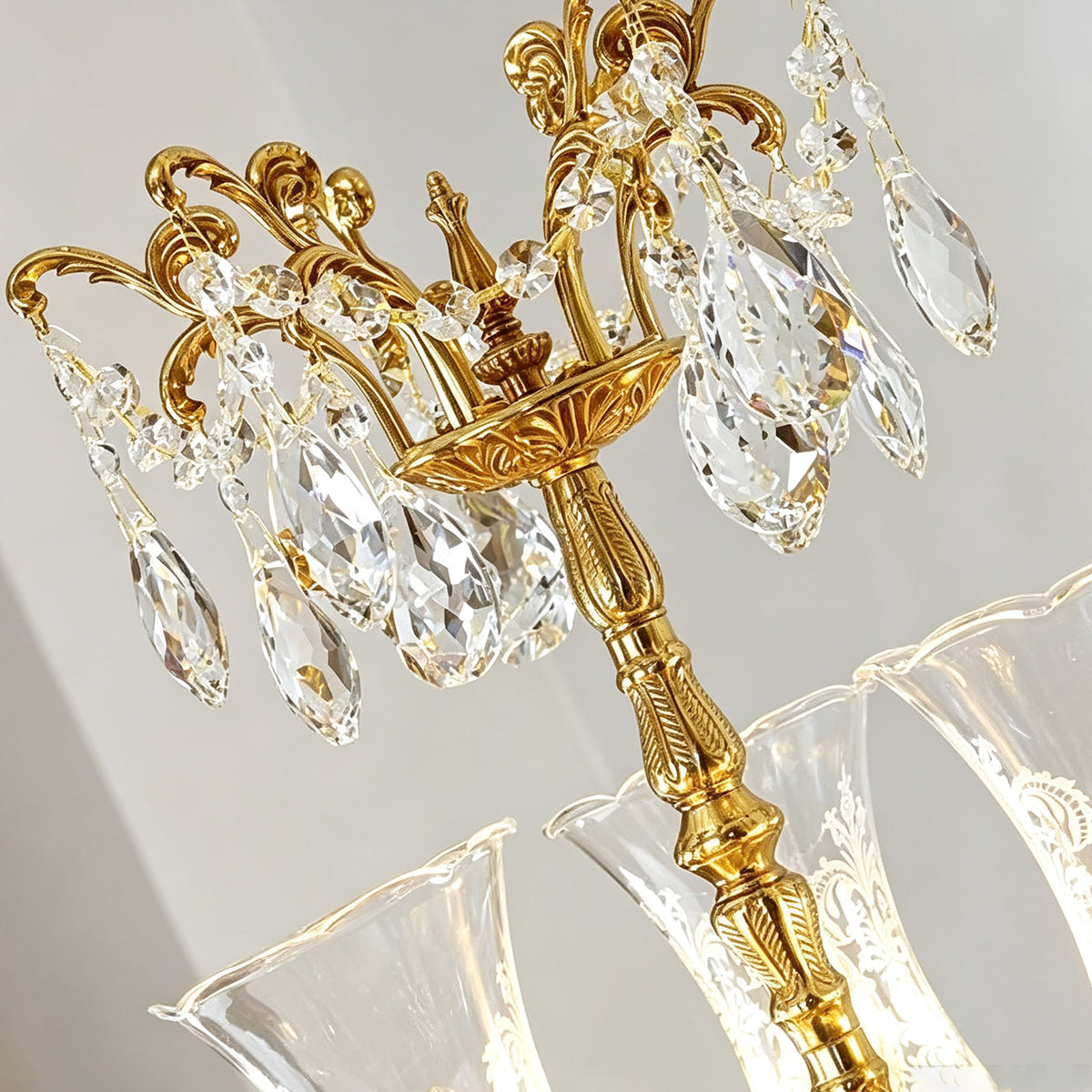 Isambard Candelabra Table Lamp | Cut Crystal and Brass | Macro shot of the top crown section with hanging crystal prisms | Severn Lighting