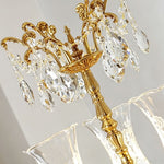 Isambard Candelabra Table Lamp | Cut Crystal and Brass | Macro shot of the top crown section with hanging crystal prisms | Severn Lighting