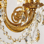 Isambard Candelabra Table Lamp | Cut Crystal and Brass | Close-up view of the ornate carved brass scroll arm and crystal droplets | Severn Lighting