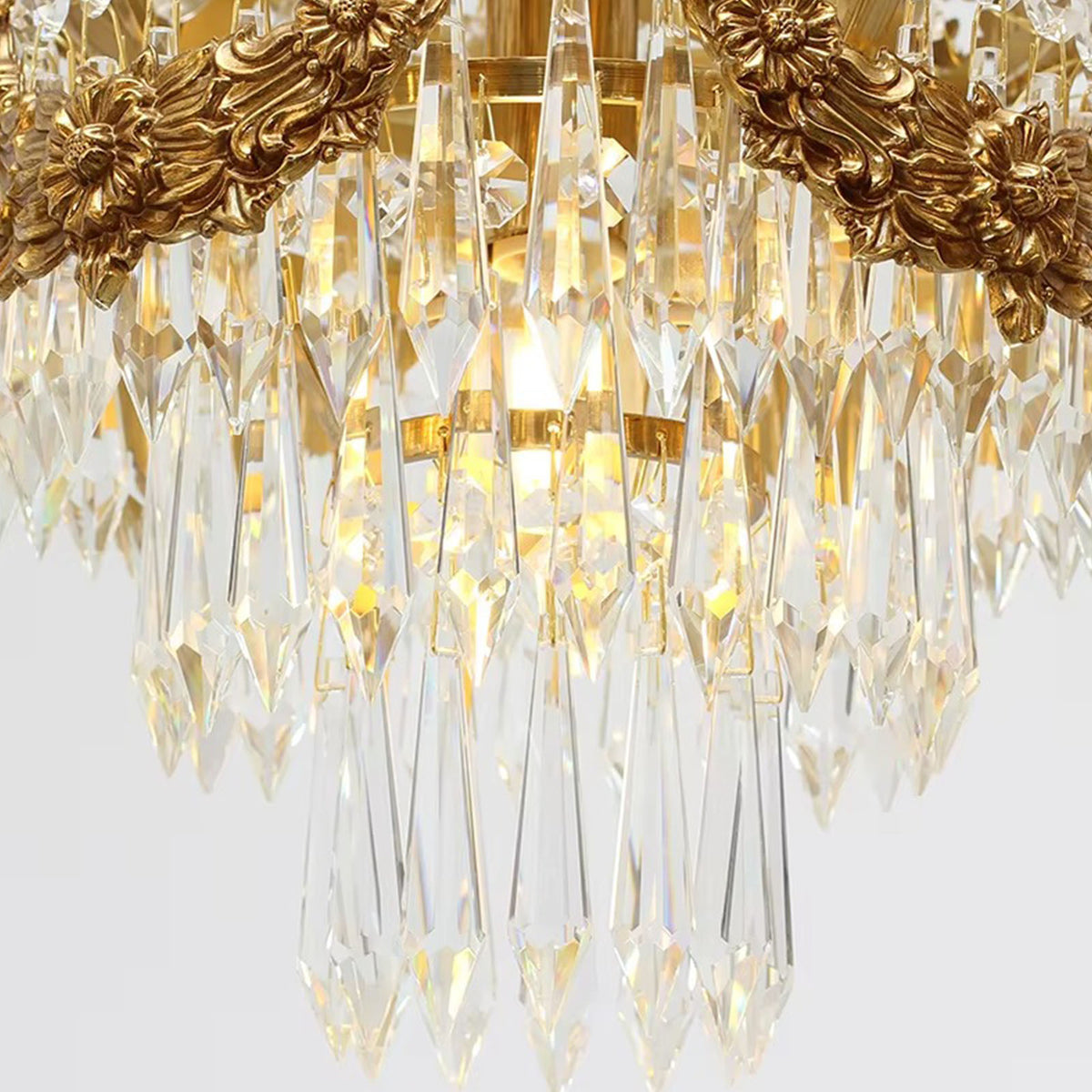 Isambard Crowned Crystal Basket Pendant Light | Cut Crystal and Brass | Close-up view of the illuminated crystal prisms and basket bottom | Severn Lighting