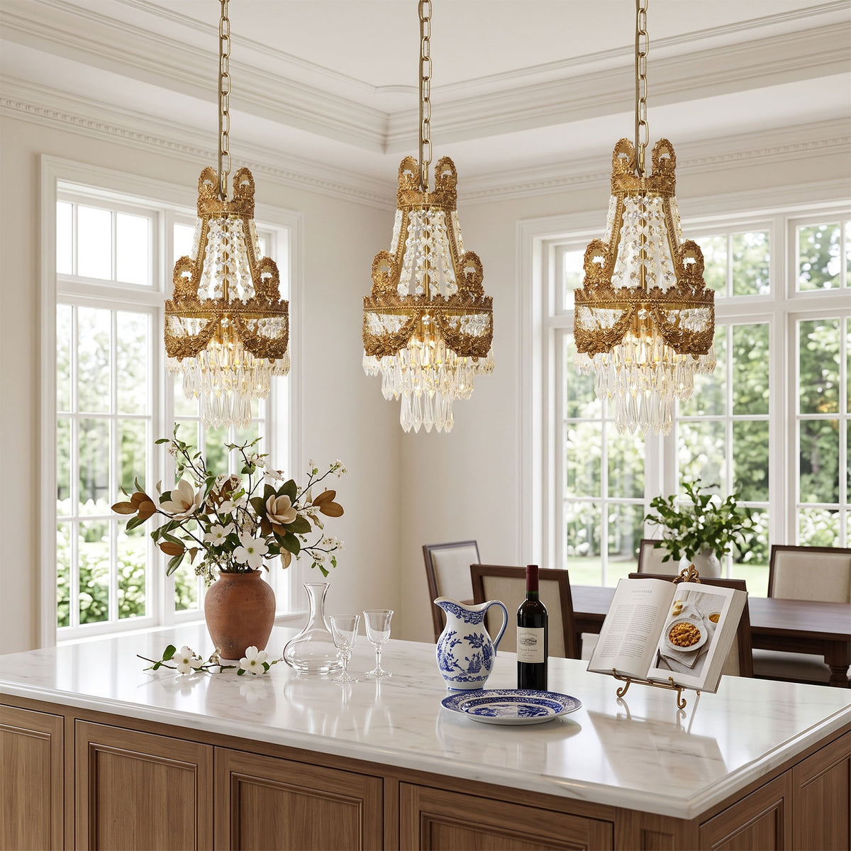 Isambard Crowned Crystal Basket Pendant Light | Cut Crystal and Brass | Trio of pendant lights suspended over a modern kitchen island | Severn Lighting