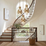 Isambard Crowned Crystal Basket Pendant Light | Cut Crystal and Brass | Displayed in a grand foyer near a curved staircase | Severn Lighting