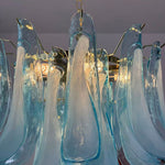 Isar Blue Petal Glass Chandelier | Blue Glass and Brass | Detail shot of blue glass petal tips attached to brass mounting hardware | Severn Lighting