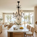 Isolde Pearl Swag Candle Chandelier | Pearl Beads, Crystal and Metal | Displayed over a long wooden dining table in a coastal dining room | Severn Lighting