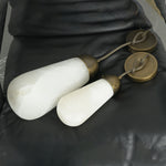 Larmelle Teardrop Sconce | Alabaster and Brass | Pair of large and small stone shades on dark leather | Severn Lighting