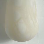 Larmelle Teardrop Sconce | Carved Alabaster | Macro detail of smooth rounded bottom curve on shade | Severn Lighting