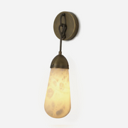 Larmelle Teardrop Sconce | Alabaster and Brass | Full view illuminated on pure white background | Severn Lighting
