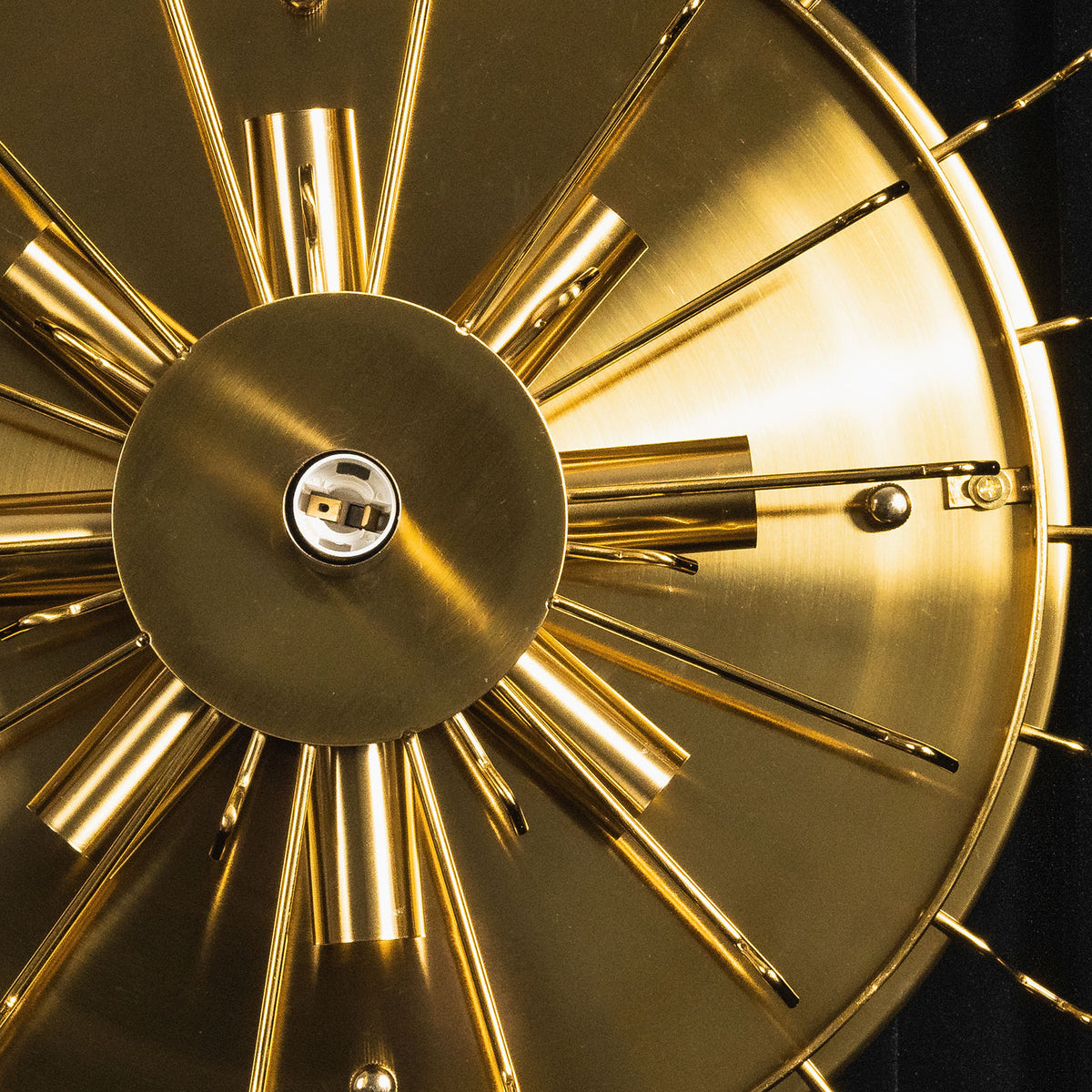Close-up of a brushed brass sunburst fixture