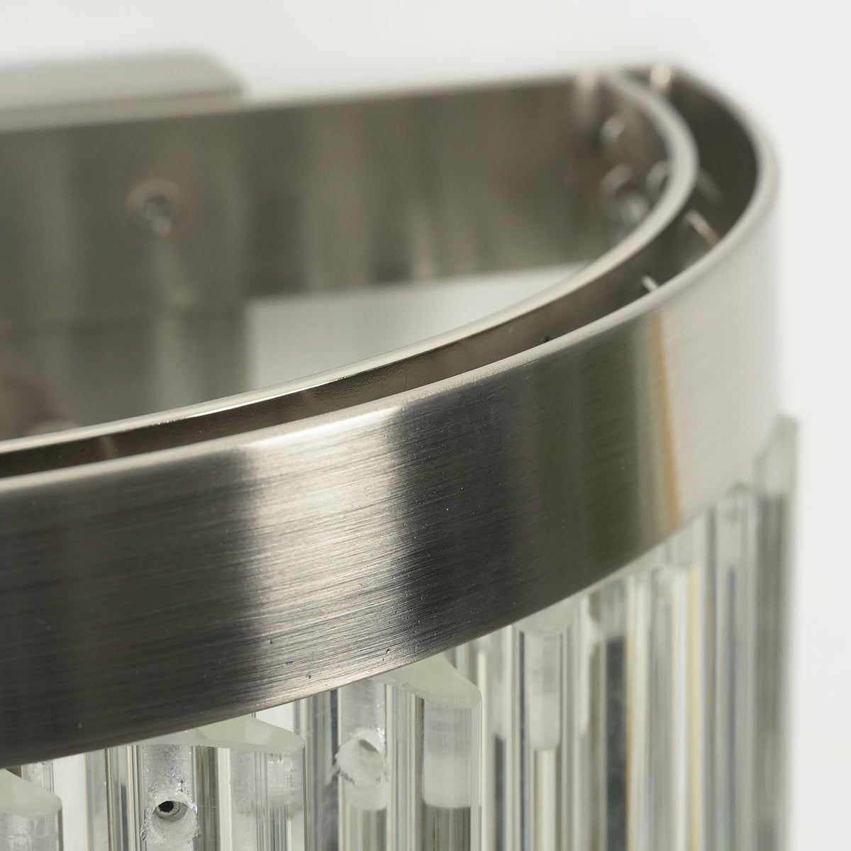 Marelle Glass Rod Tiered Wall Lamp | Clear Glass Rods and Metal | Close-up detail of brushed metal rim and vertical clear glass rods | Severn Lighting