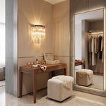 Marelle Glass Rod Tiered Wall Lamp | Clear Glass Rods and Metal | Displayed in a luxury dressing room beside a vanity mirror and ottoman stool | Severn Lighting