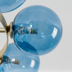 Marisol Aquamarine Glass Bubble Chandelier | Aquamarine Glass and Brass | Detail view of clustered aquamarine glass spheres capturing light reflections | Severn Lighting