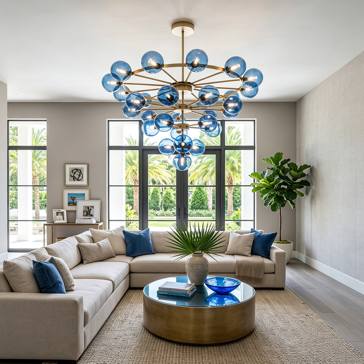 Marisol Aquamarine Glass Bubble Chandelier | Aquamarine Glass and Brass | Suspended over an L-shaped sectional sofa in a spacious lounge area | Severn Lighting