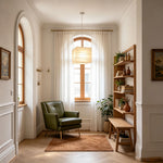 Marlen Squared Paper Column Pendant | Washi Paper and Metal | Displayed in a cozy reading corner near a green armchair | Severn Lighting