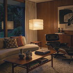 Marlen Squared Paper Column Pendant | Washi Paper and Metal | Glowing warmly in an evening living room setting with cozy furniture | Severn Lighting