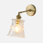 Merrick Fluted Glass Bell Wall Lamp | Fluted Glass and Brass | Front full view on a pure white background, illuminated | Severn Lighting