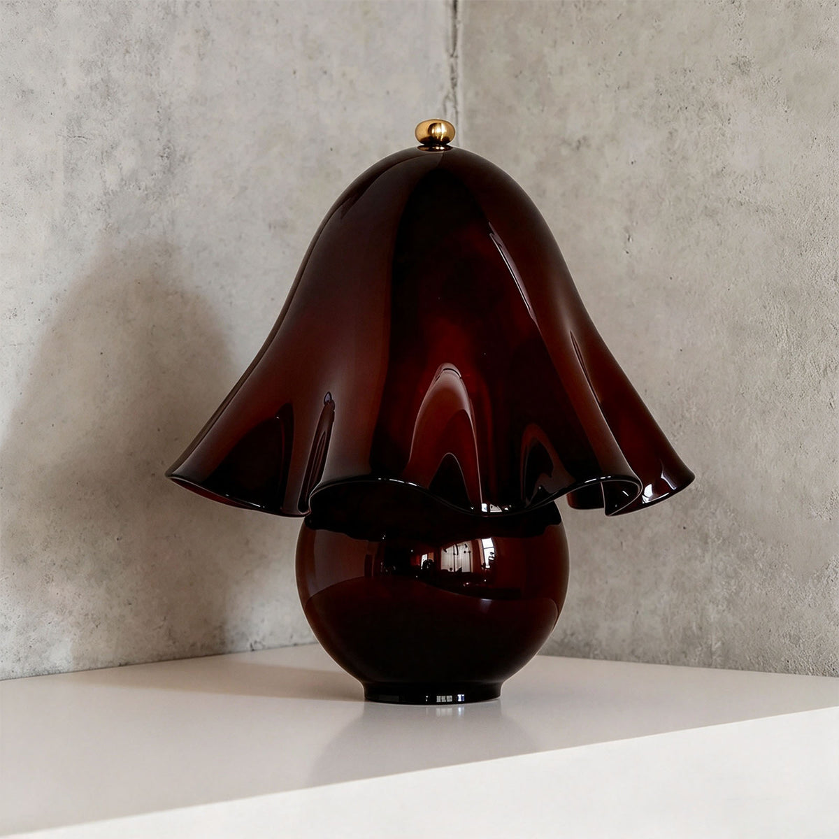 Mouchelle Mushroom Lamp | Burgundy Wine Glass | Solid wine red variant unlit resting on corner shelf | Severn Lighting