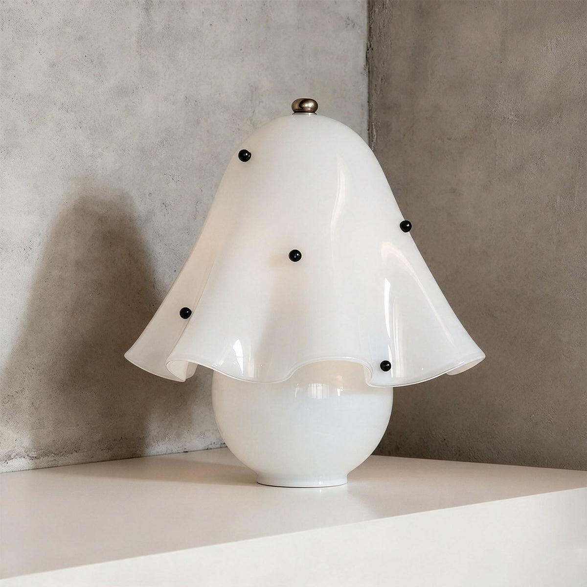 Mouchelle Mushroom Lamp | White Polka Dot Glass | Polka dot ruffled variant unlit on display shelf | Severn Lighting