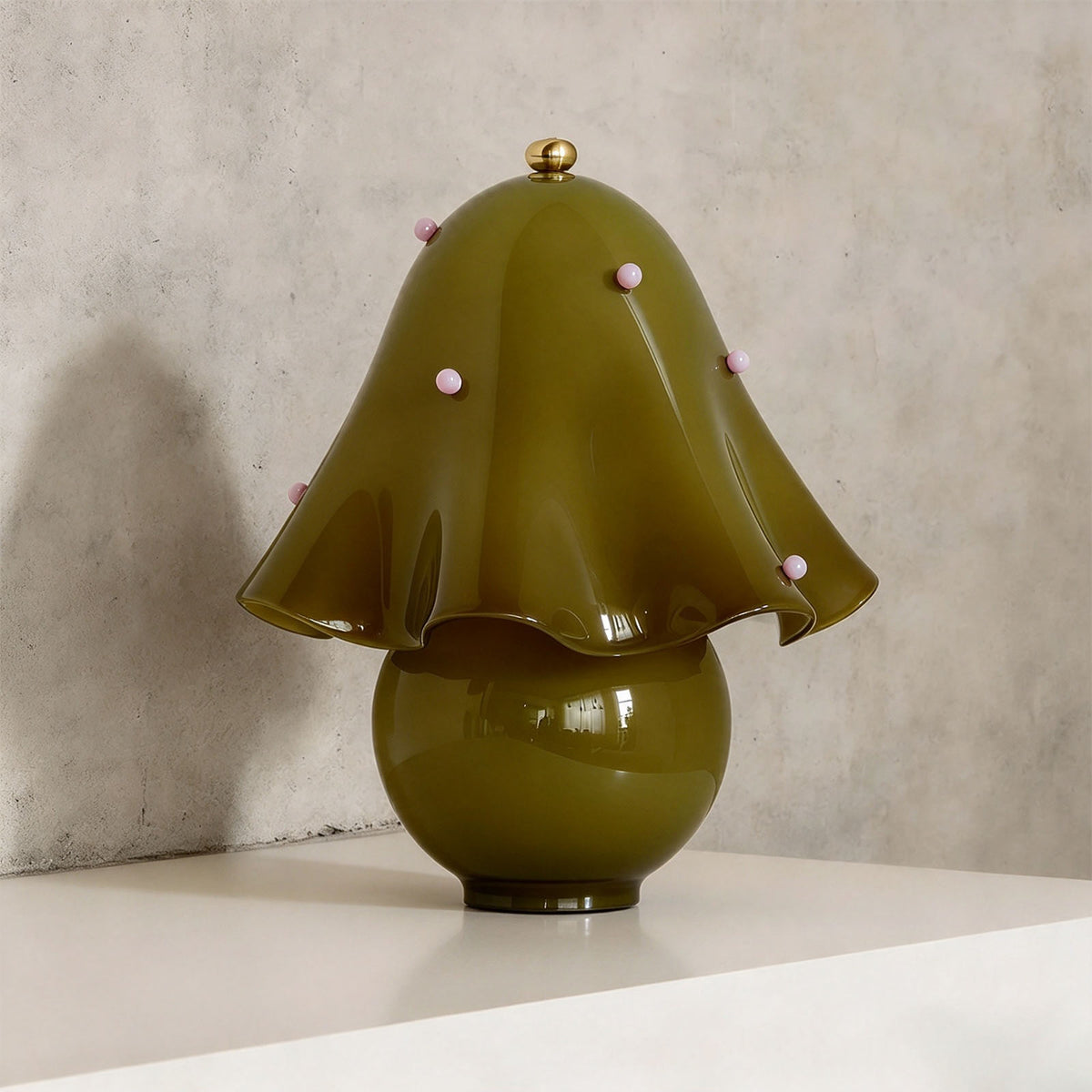 Mouchelle Mushroom Lamp | Green Polka Dot Glass | Green dotted ruffled variant unlit on shelf ledge | Severn Lighting