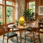 Mouchelle Mushroom Lamp | Blown Glass and Brass | Lit on a round dining table in a sunlit wooden room | Severn Lighting