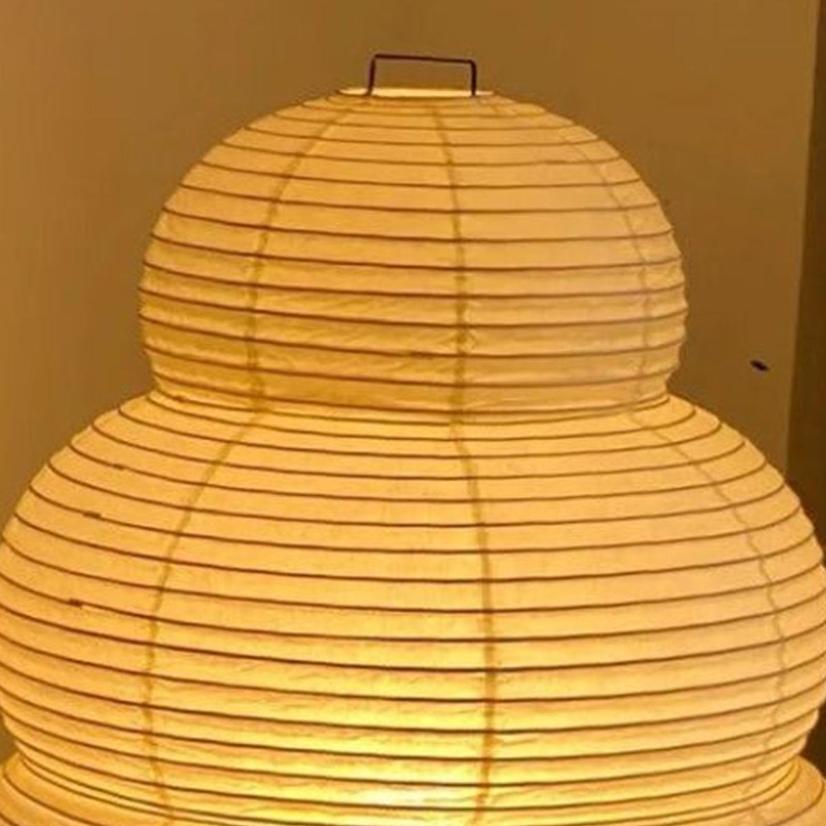 Nerine Tiered Washi Paper Table Lamp | Washi Paper and Metal | Close-up view highlighting the illuminated ribbed paper texture | Severn Lighting