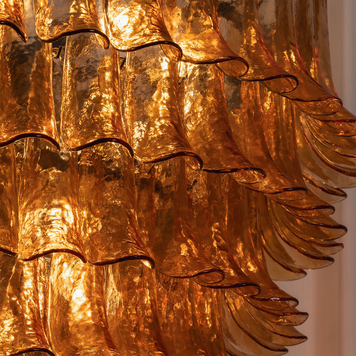 Odile Amber Petal Tier Chandelier | Amber Glass and Metal | Macro detail shot of the glowing textured amber glass petals | Severn Lighting