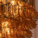 Odile Amber Petal Tier Chandelier | Amber Glass and Metal | Macro detail shot of the glowing textured amber glass petals | Severn Lighting
