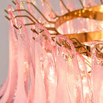 Ombeline Tiered Pink Glass Chandelier | Pink Glass and Brass | Close-up detail of the brass frame and hooks holding pink glass petals | Severn Lighting