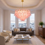 Ombeline Tiered Pink Glass Chandelier | Pink Glass and Brass | Hanging in a classic living room with beige sofas and bay windows | Severn Lighting