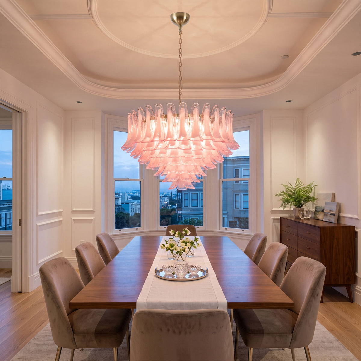 Ombeline Tiered Pink Glass Chandelier | Pink Glass and Brass | Centered in a formal dining room with a long table and tray ceiling | Severn Lighting