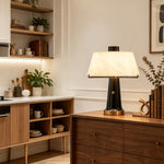 Orsino Alabaster Trapezoid Table Lamp | Natural Alabaster, Black Metal and Brass | Styled on a wooden kitchen counter near open shelving | Severn Lighting