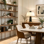 Orsino Alabaster Trapezoid Table Lamp | Natural Alabaster, Black Metal and Brass | Illuminating a dining space on a wooden cabinet near a large bookshelf | Severn Lighting