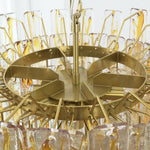 Orvelane Amber Swirl Glass Tiered Chandelier | Amber Swirl Glass and Brass | Top-down view showing concentric circular brass tiers and internal frame layout | Severn Lighting