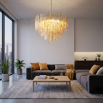 Orvelane Amber Swirl Glass Tiered Chandelier | Amber Swirl Glass and Brass | Lighting a contemporary living room over a low grey couch and coffee table | Severn Lighting
