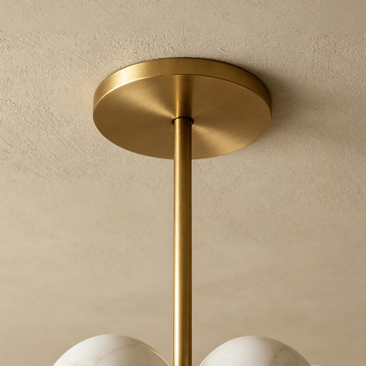 Ottoline Alabaster Cluster Chandelier | Natural Alabaster and Brass | Detailed close-up view highlighting the polished gold metal ceiling canopy and support rod | Severn Lighting