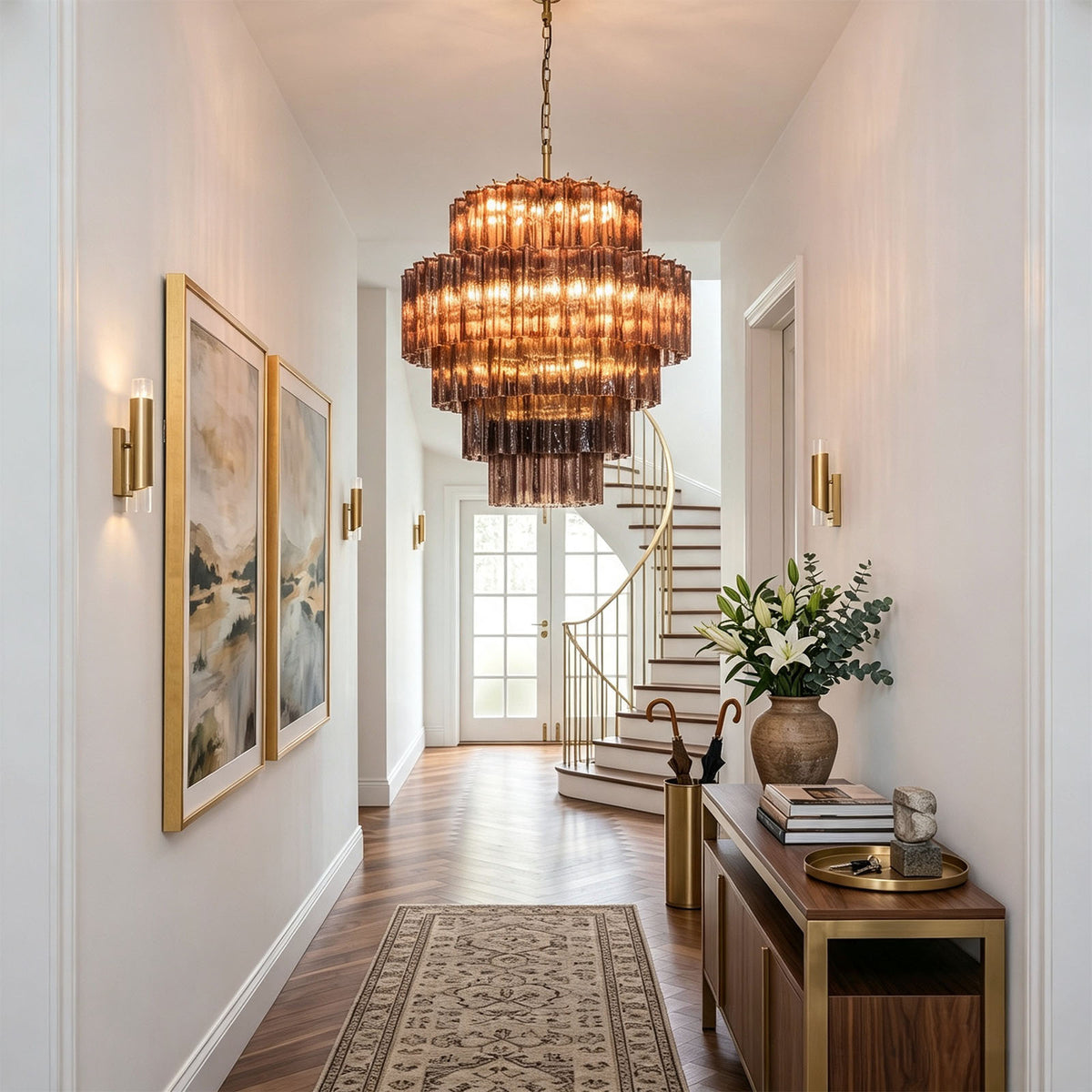 Ottoline Tiered Glass Chandelier | Textured Glass and Brass | Displayed in a long hallway corridor above a patterned rug | Severn Lighting