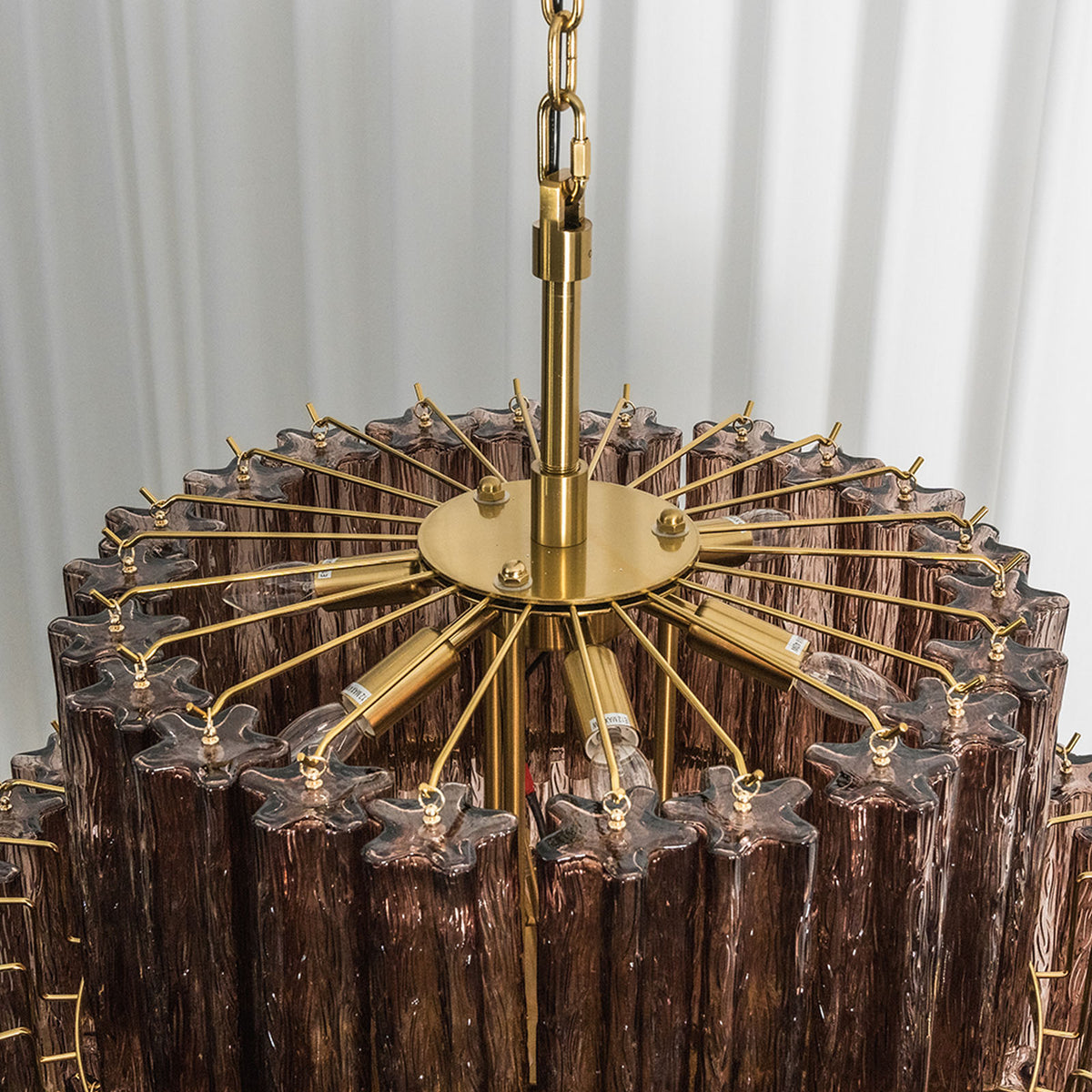 Ottoline Tiered Glass Chandelier | Textured Glass and Brass | Top perspective showing the brass central structure and support arms | Severn Lighting
