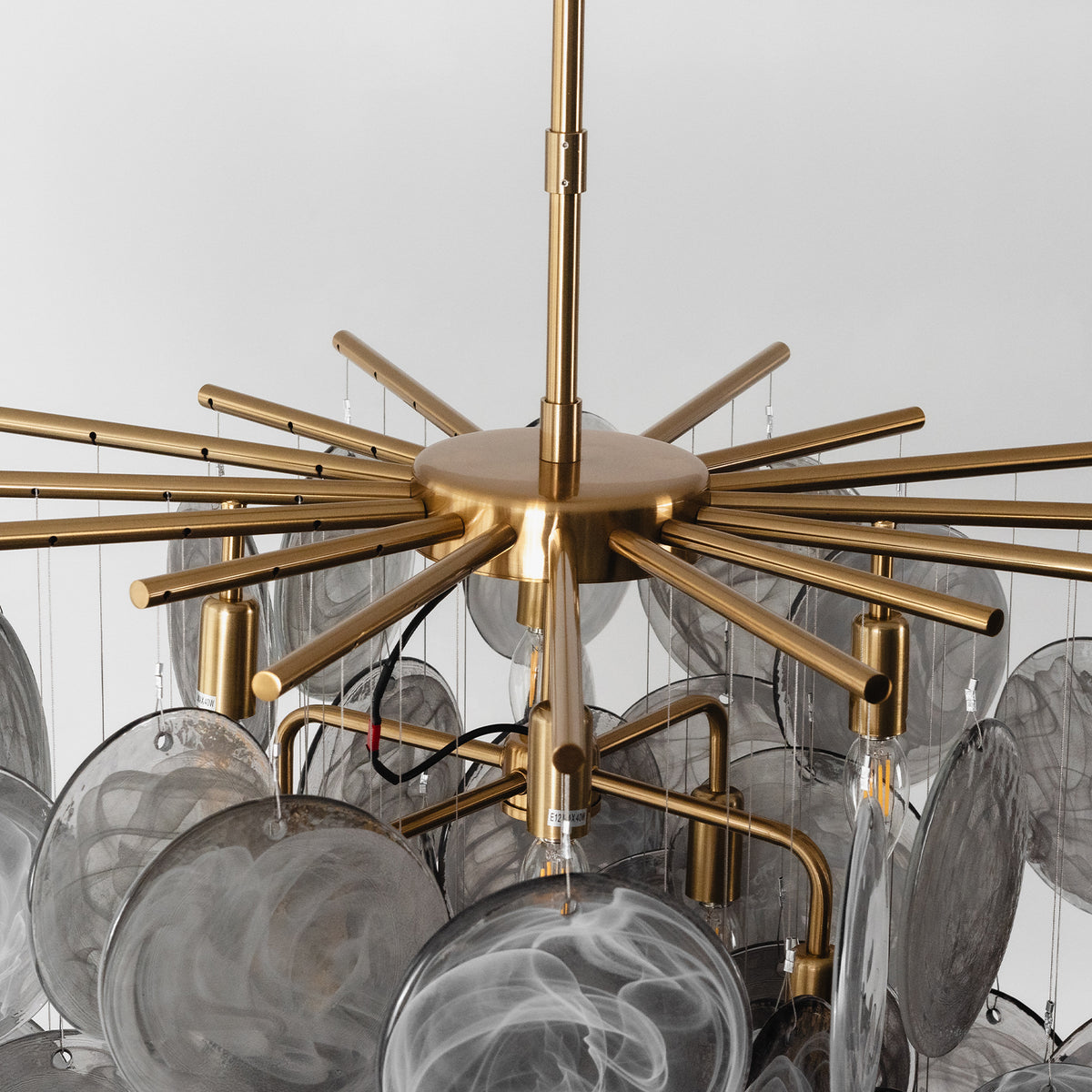 Perrin Smoked Glass Cloud Chandelier | Smoked Glass and Brass | Top-down close-up view of the brass radial arms and frame | Severn Lighting