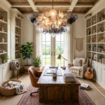Perrin Smoked Glass Cloud Chandelier | Smoked Glass and Brass | Centered in a home office study with wooden desk and bookshelves | Severn Lighting